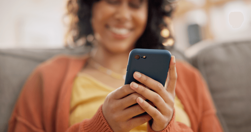 Woman at home using phone